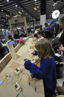 Vast numbers of kids soldering up circuitry for every imaginable type of electronic device